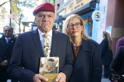 NYC mayoral hopeful Curtis Sliwa shows up to election poll site in cat tie and a book for feline lovers