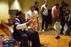 Patriots player visits Heading Home shelter at Lowell ICC to hand out toys to kids